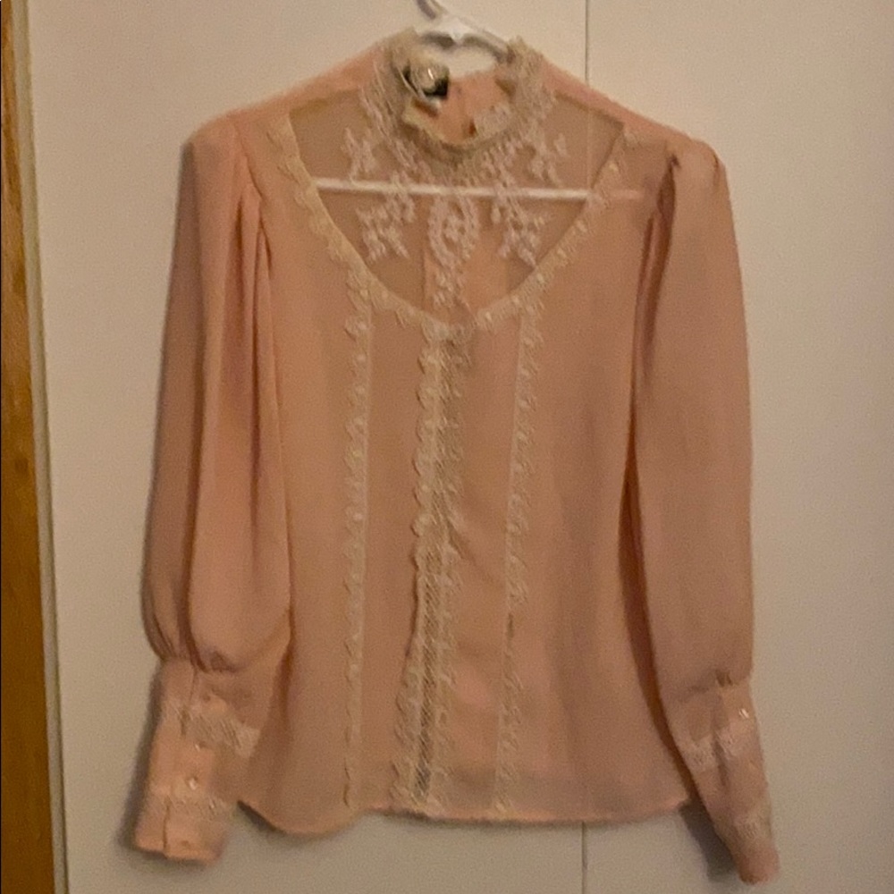 Romantic lace and buttons blouse.